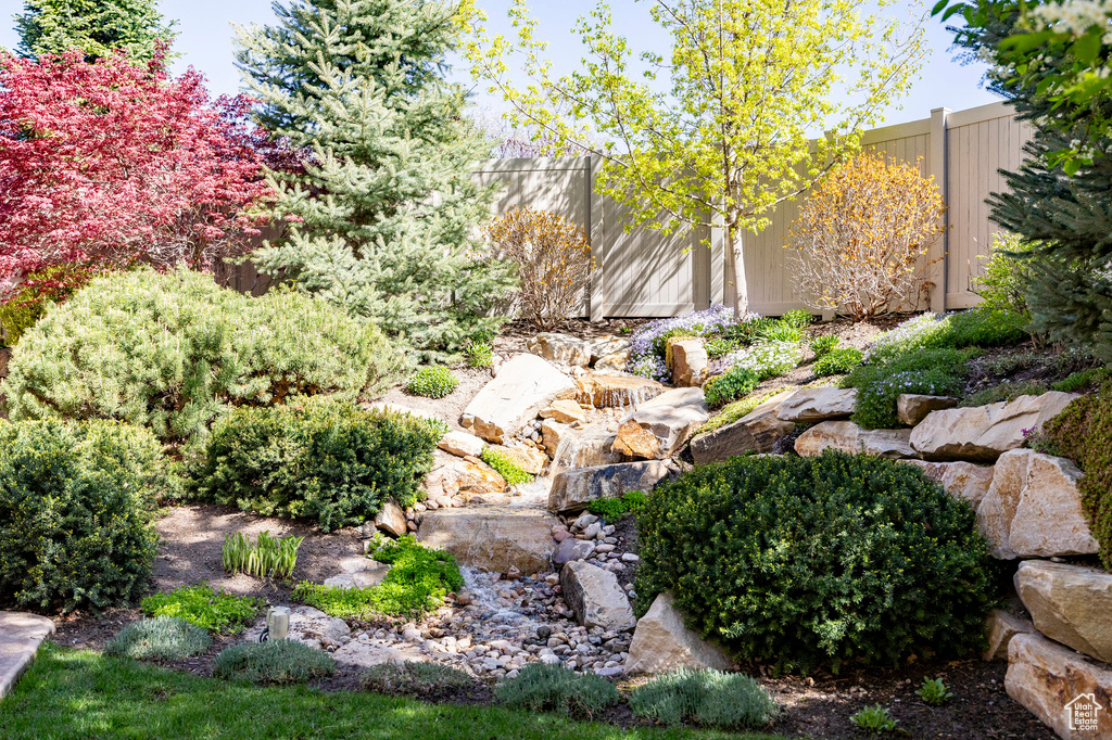 View of yard featuring fence
