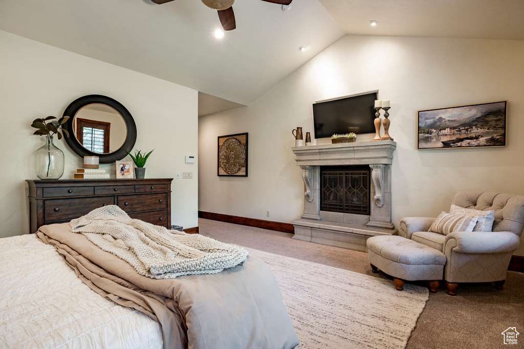 Carpeted bedroom featuring a premium fireplace, a ceiling fan, vaulted ceiling, and recessed lighting