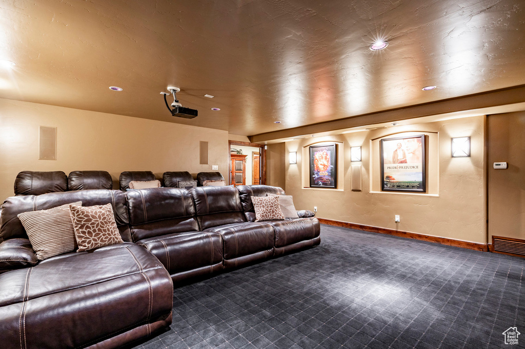 Home theater room with carpet floors, recessed lighting, and baseboards