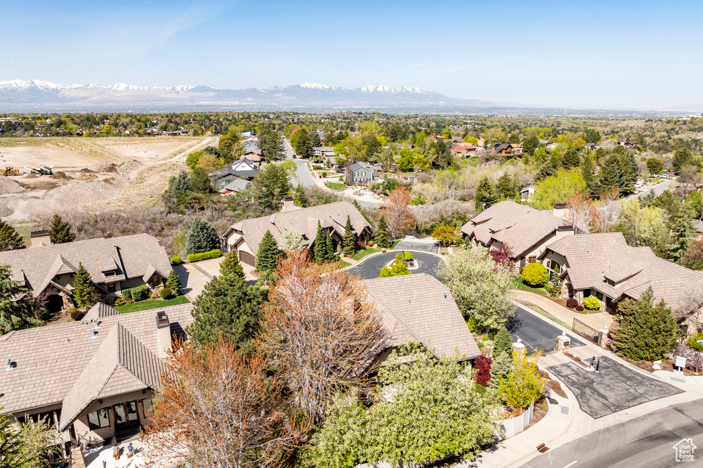 Birds eye view of property with a residential view and a mountain view