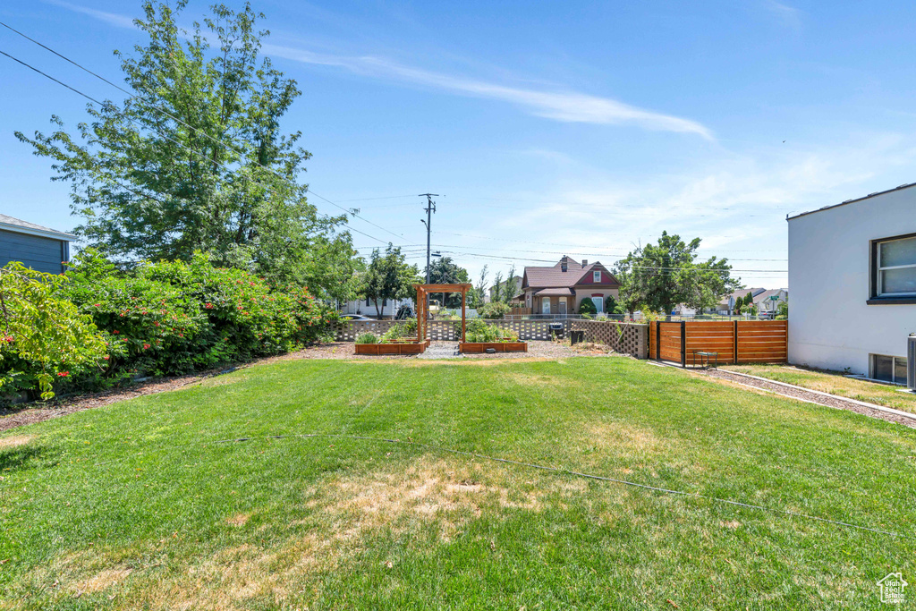 View of yard with fence