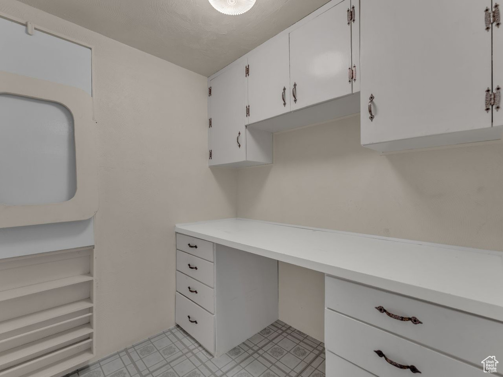 Unfurnished office featuring light floors