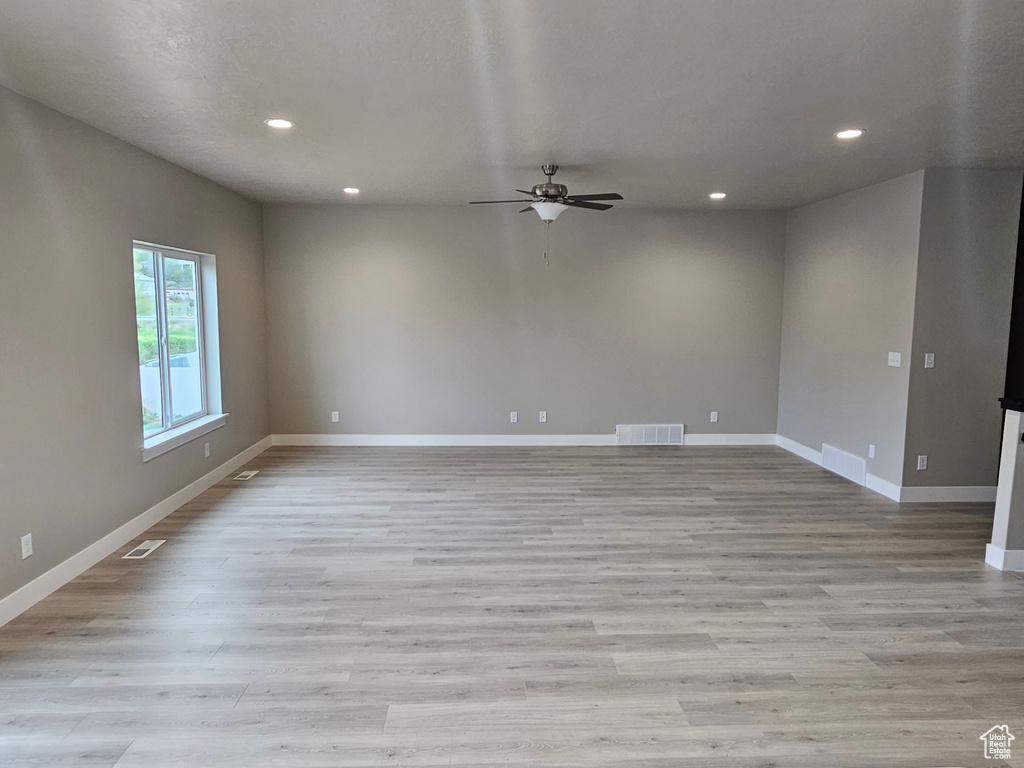 Empty room with visible vents, recessed lighting, baseboards, and ceiling fan