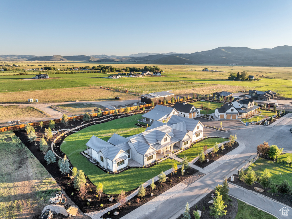 Drone / aerial view with a mountain view and a rural view