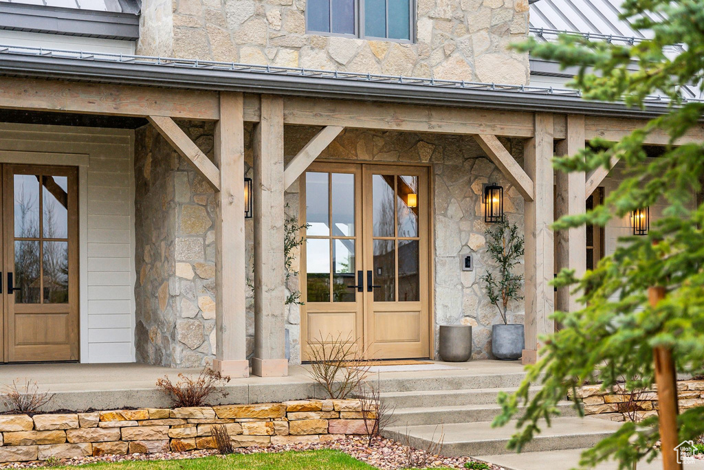 Property entrance featuring stone siding