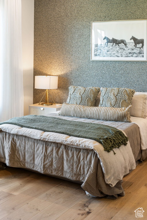 Bedroom with wood finished floors