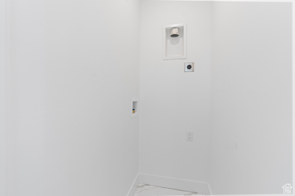 Laundry room with laundry area, hookup for a washing machine, marble finish floor, baseboards, and hookup for an electric dryer
