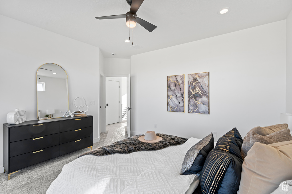 Bedroom with a ceiling fan and recessed lighting