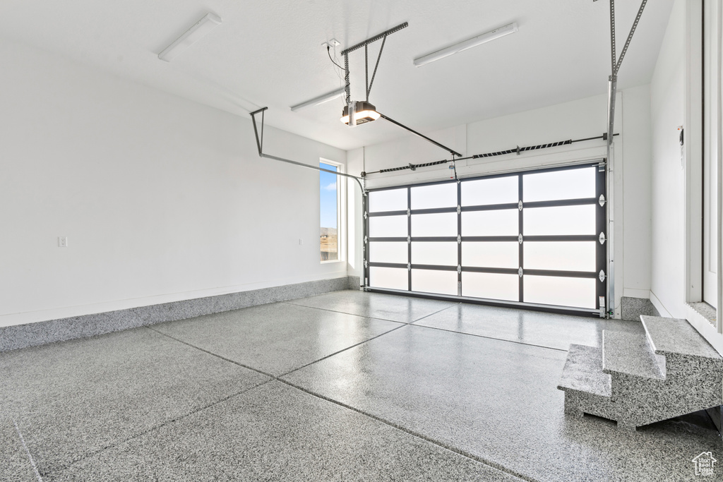 Garage featuring a garage door opener