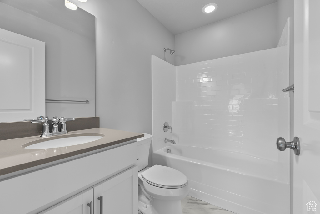 Full bath with vanity, marble finish floor, shower / bathtub combination, toilet, and recessed lighting