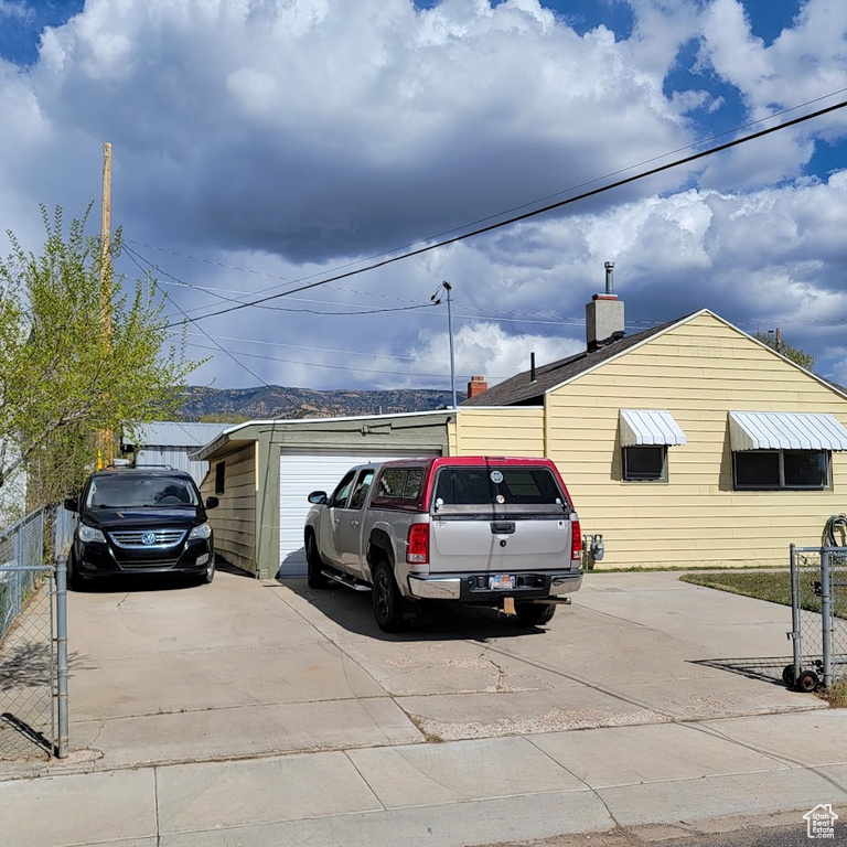 View of parking featuring fence