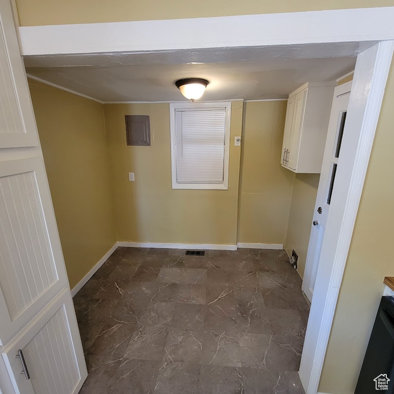 Clothes washing area with baseboards, marble finish floor, and visible vents