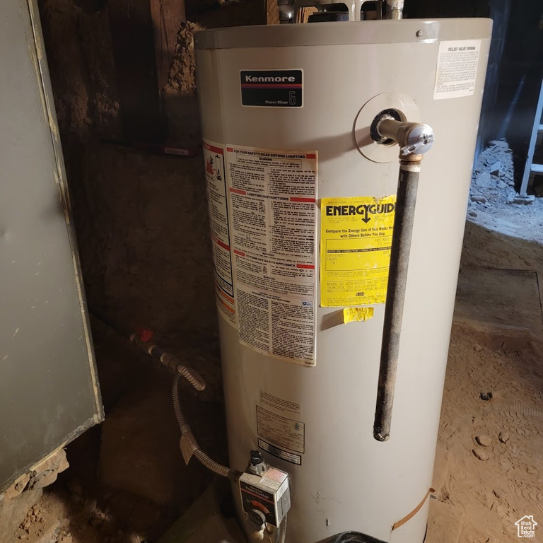 Utility room featuring gas water heater
