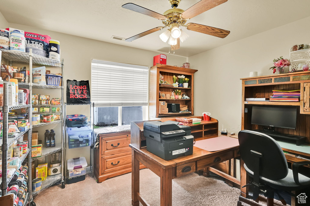 Office with ceiling fan, light carpet, and visible vents