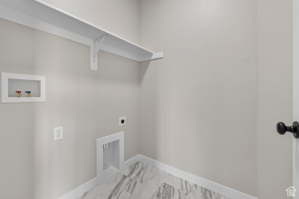 Laundry room featuring laundry area, hookup for a washing machine, marble finish floor, baseboards, and hookup for an electric dryer