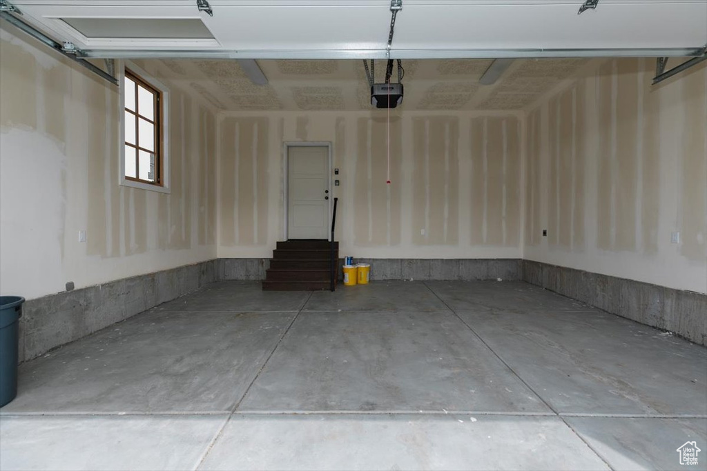 Garage featuring a garage door opener