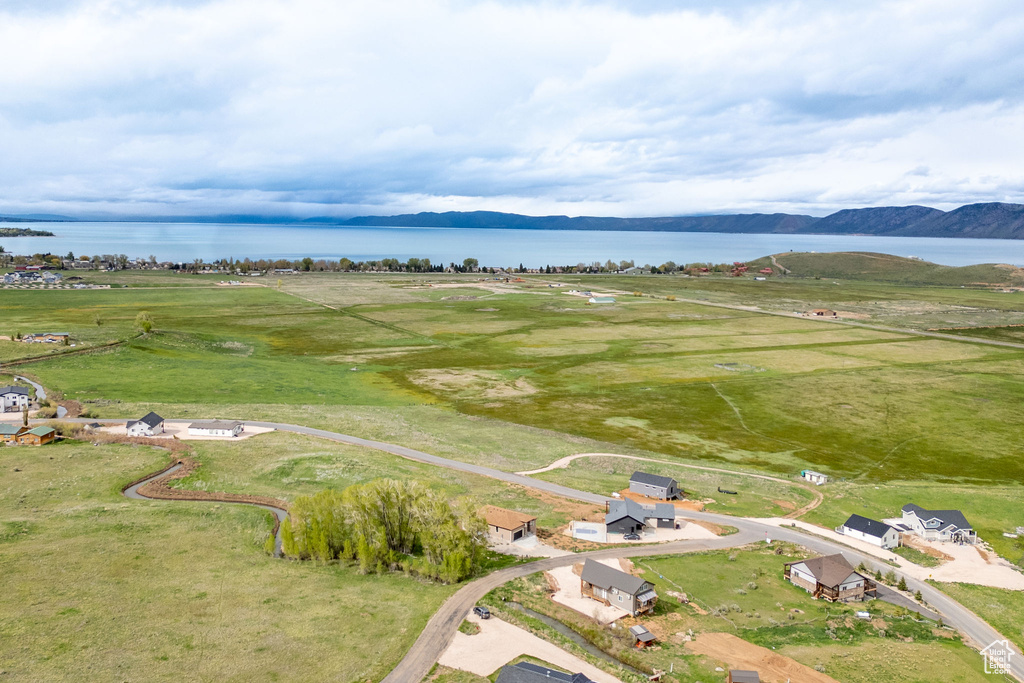 View of property location featuring a water and mountain view
