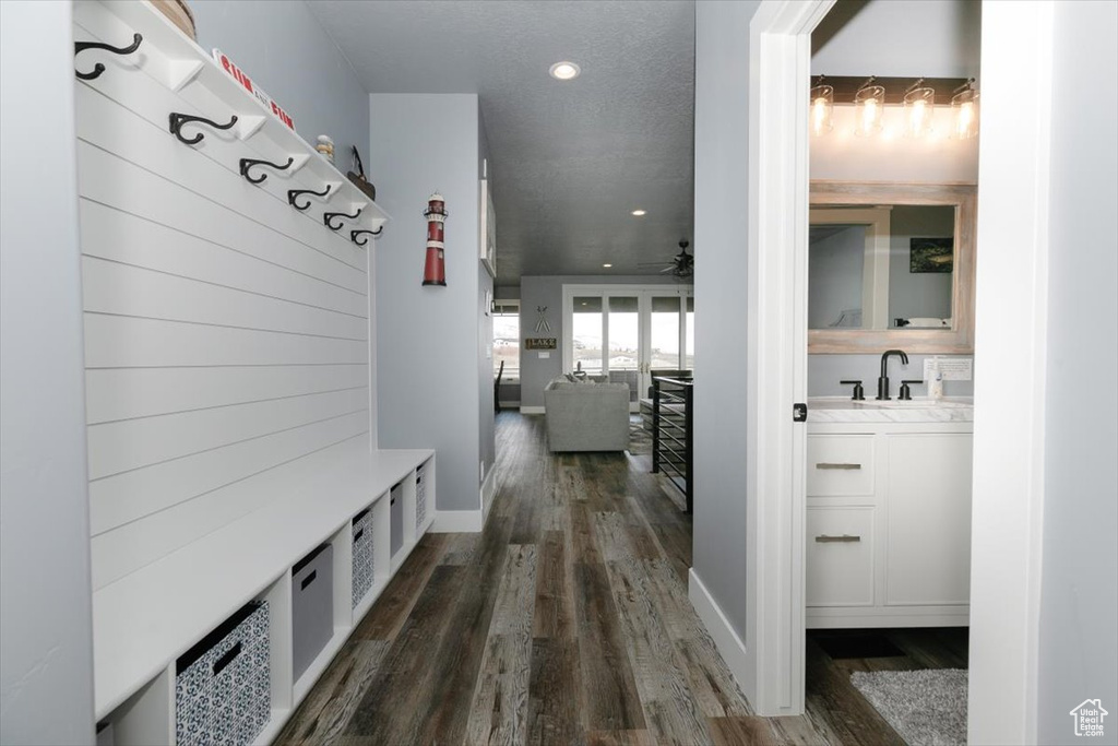 Mudroom with baseboards, recessed lighting, a ceiling fan, dark wood-type flooring, and a sink