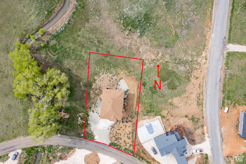 Aerial overview of property\'s location featuring property parcel outlined