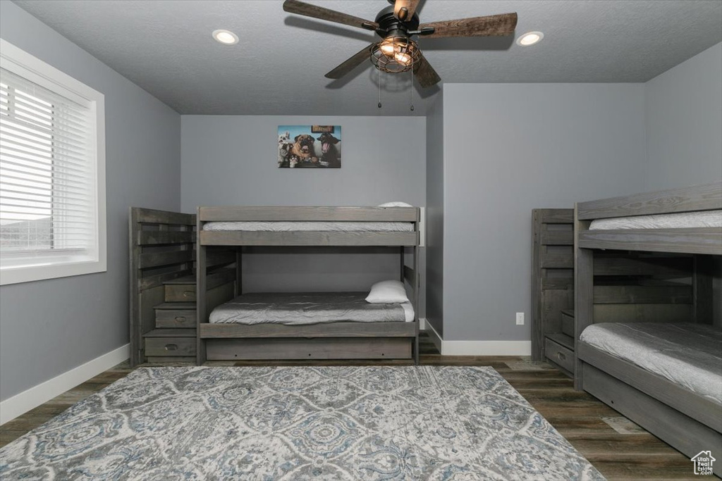Bedroom featuring baseboards, a ceiling fan, and recessed lighting
