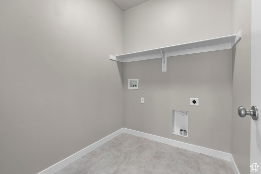 Laundry area featuring laundry area, washer hookup, baseboards, and hookup for an electric dryer
