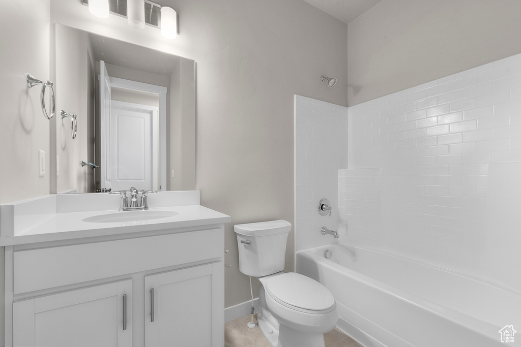 Bathroom featuring vanity, toilet, and bathing tub / shower combination