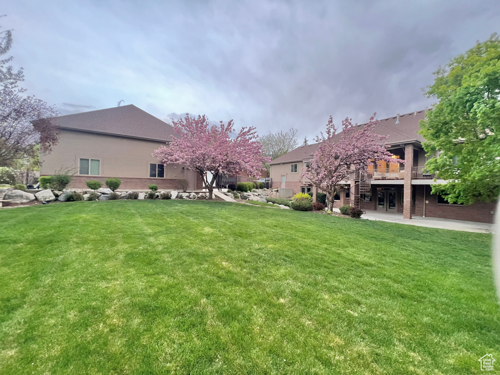 View of yard with a patio and a deck