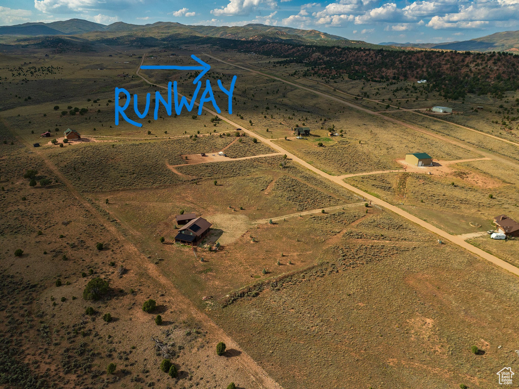 Bird's eye view with view of desert, a mountain view, and a rural view