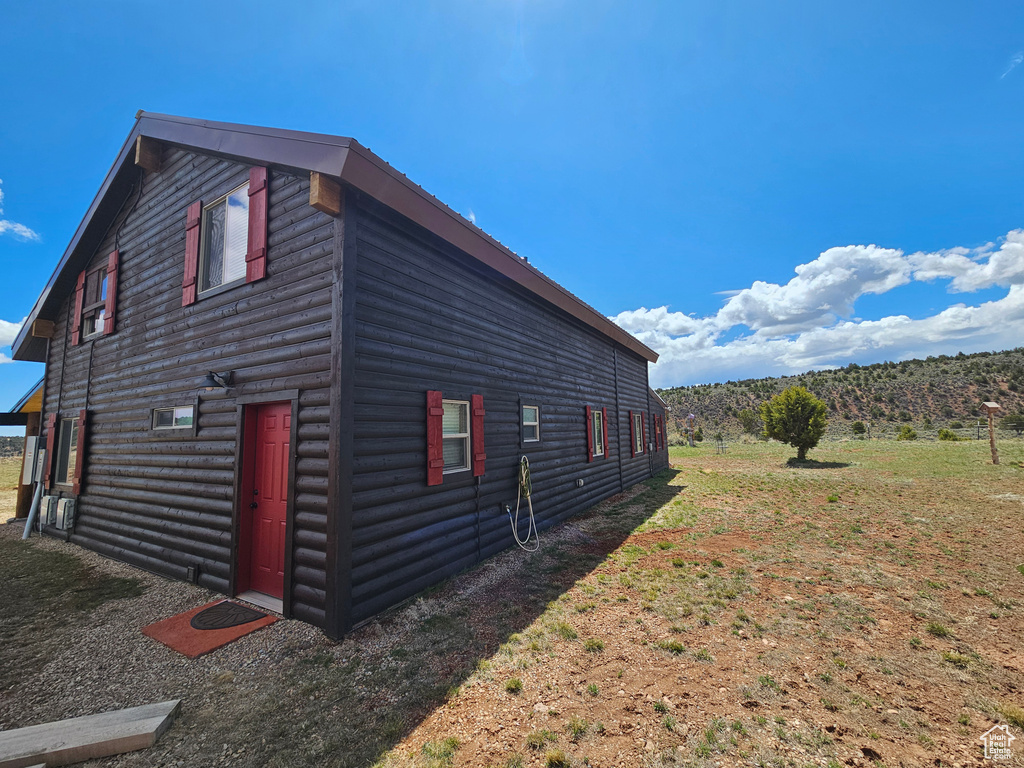 View of side of property with log veneer siding