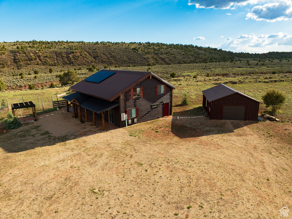 Birds eye view of property with a rural view