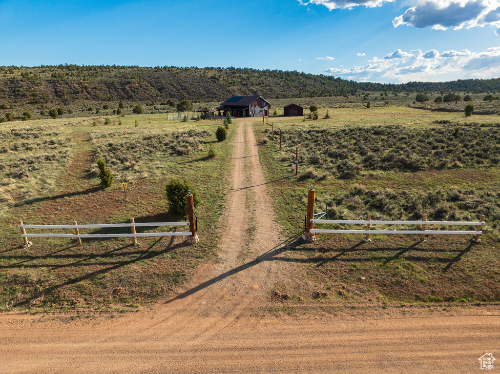 Birds eye view of property with a rural view