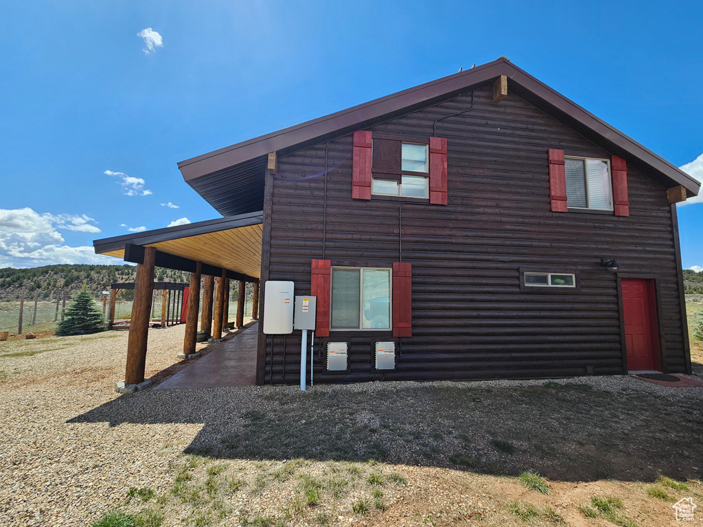 View of home\'s exterior featuring log veneer siding