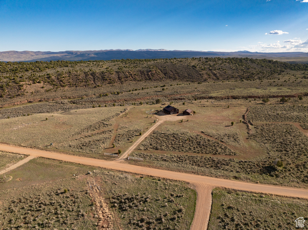 Birds eye view of property featuring a rural view, a mountain view, and a desert view