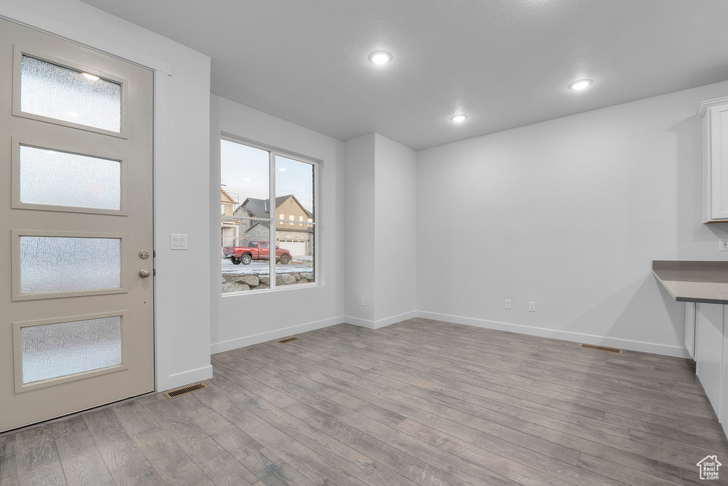Entryway with visible vents, recessed lighting, baseboards, and wood finished floors