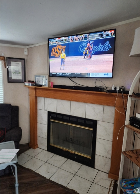 Interior details with crown molding and a fireplace