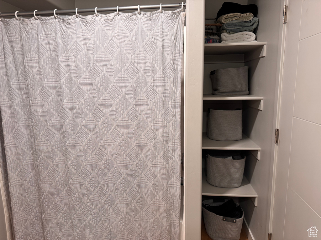 Bathroom with a shower with shower curtain