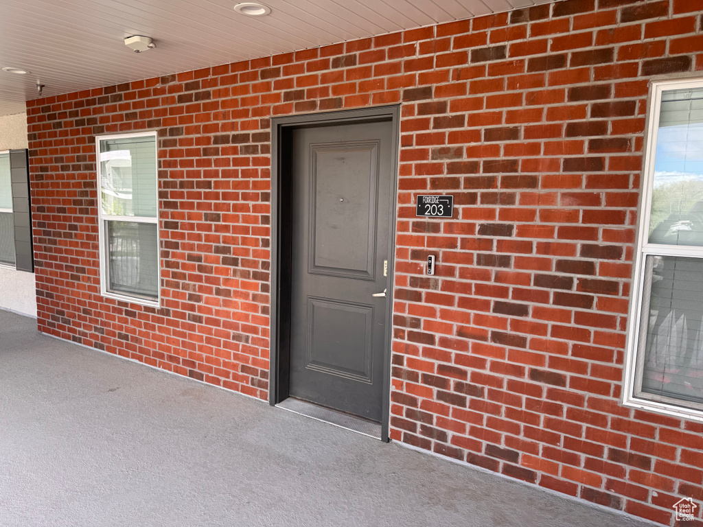 Property entrance with brick siding