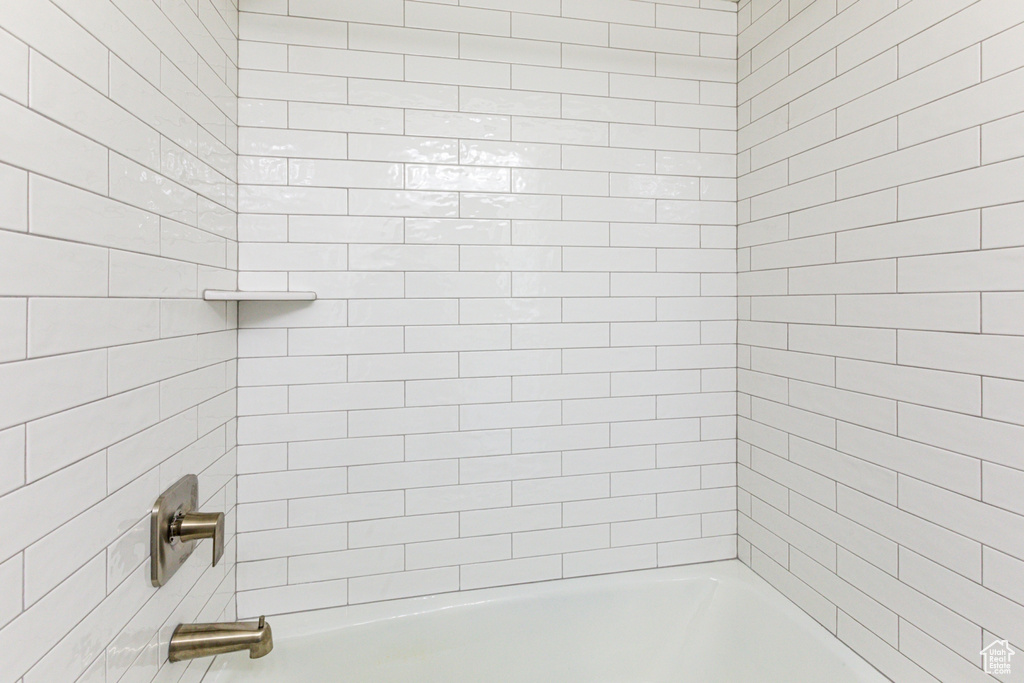 Bathroom featuring shower / washtub combination
