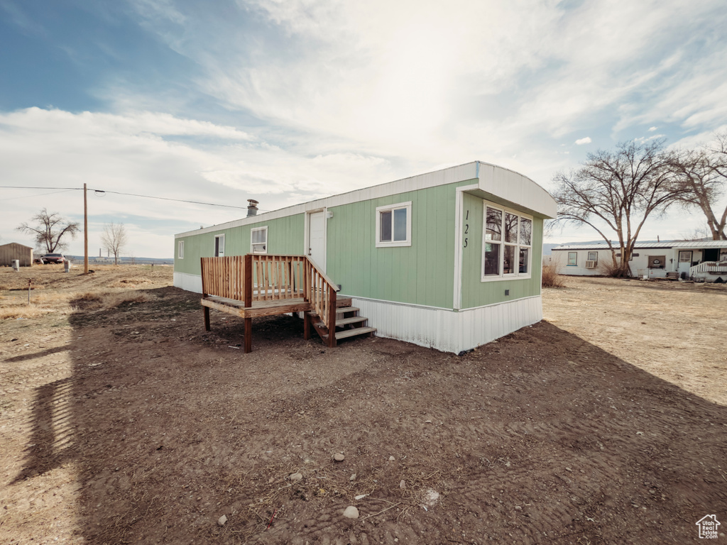 Rear view of house with a deck