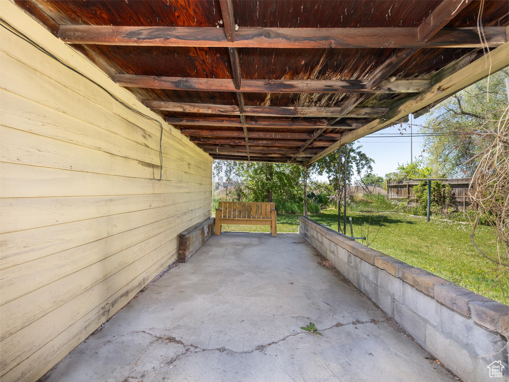 View of patio with a carport