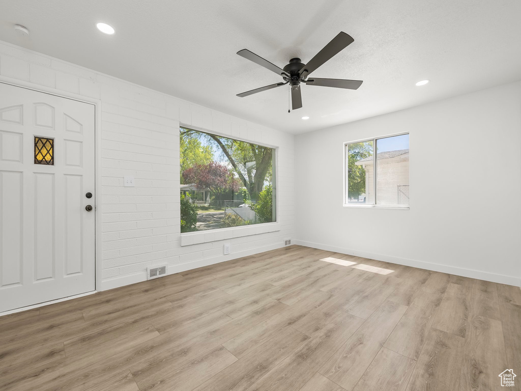 Spare room with visible vents, a ceiling fan, wood finished floors, and recessed lighting