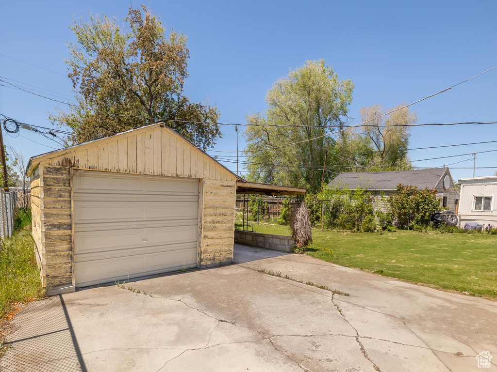 Garage with a garage and driveway