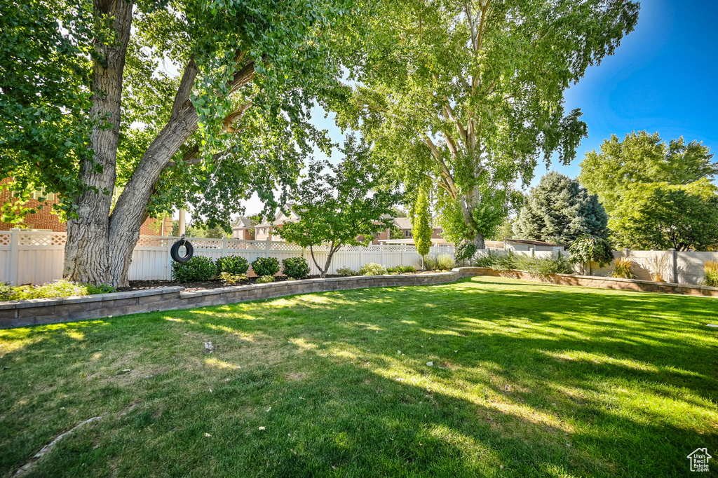 View of yard featuring a fenced backyard