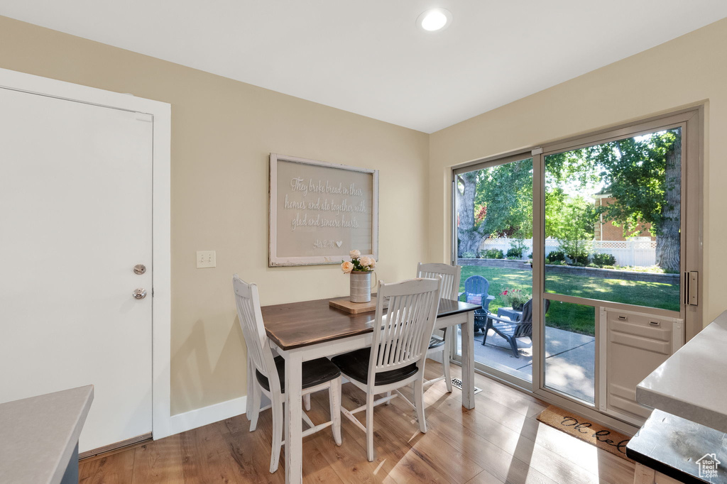 Dining room featuring recessed lighting, baseboards, and light wood-type flooring