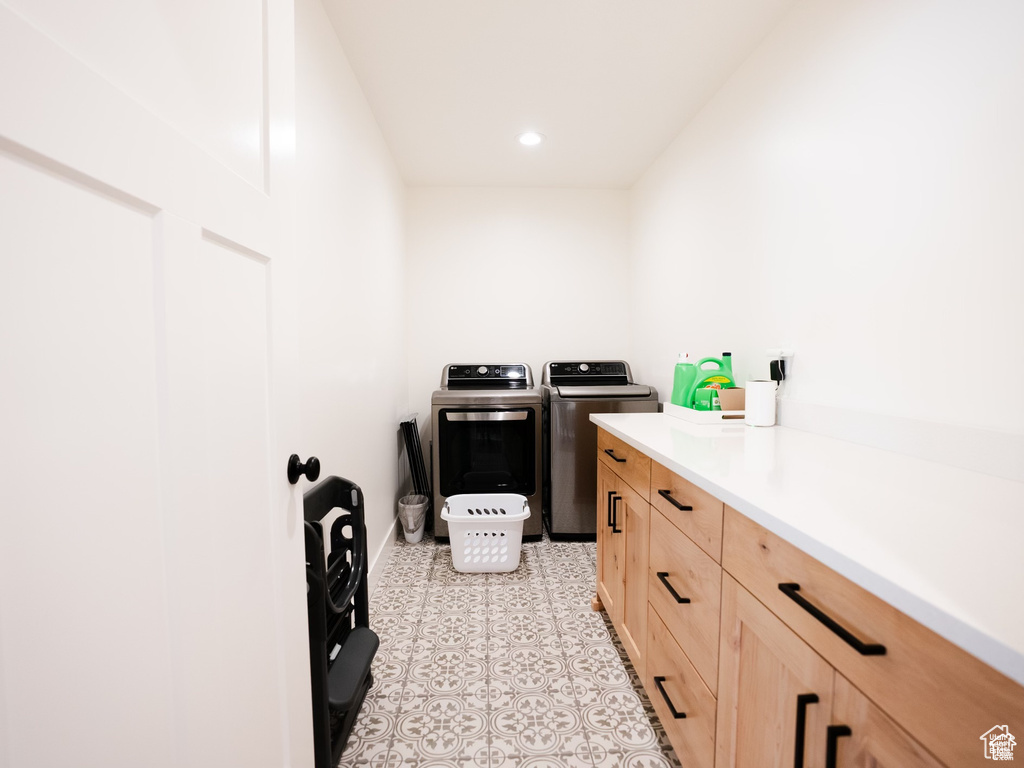 Washroom featuring independent washer and dryer, recessed lighting, baseboards, and light floors
