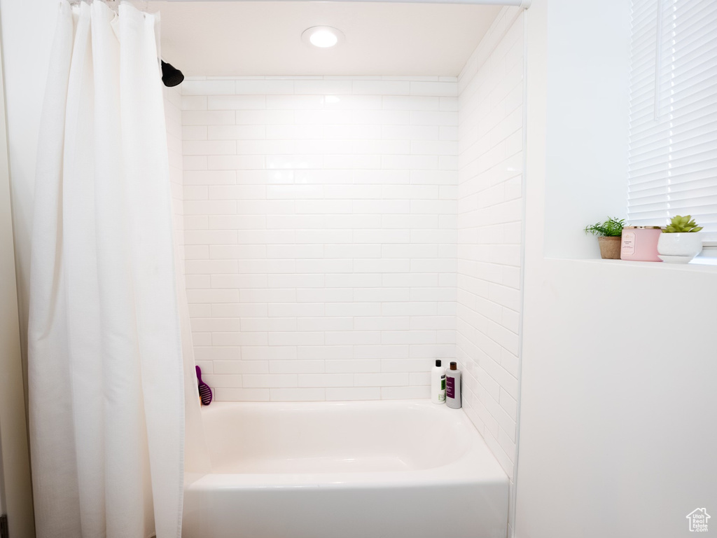 Full bathroom featuring recessed lighting and shower / bath combination with curtain