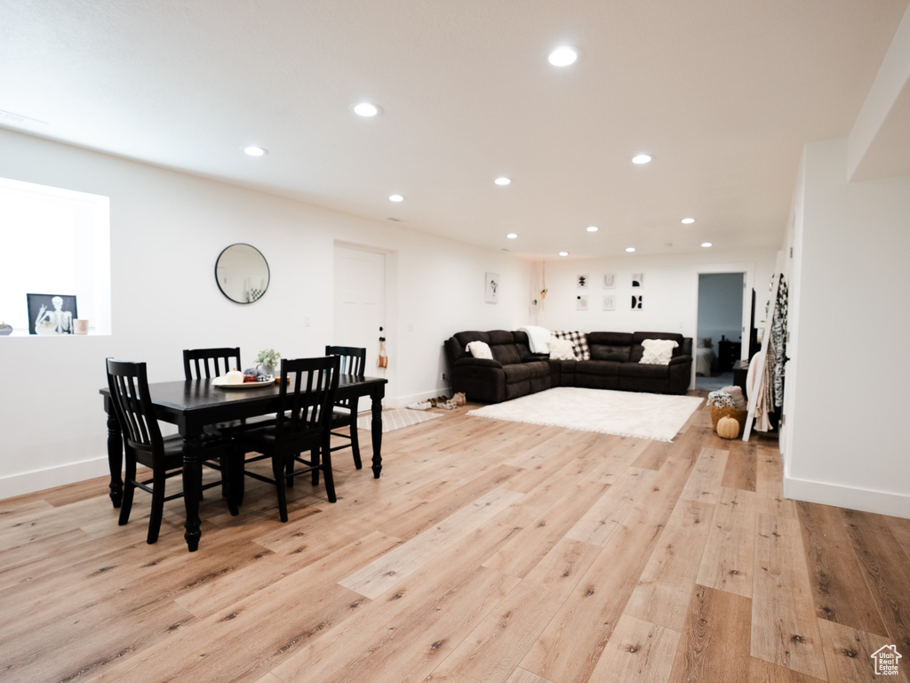 Dining space with recessed lighting, baseboards, and light wood-type flooring