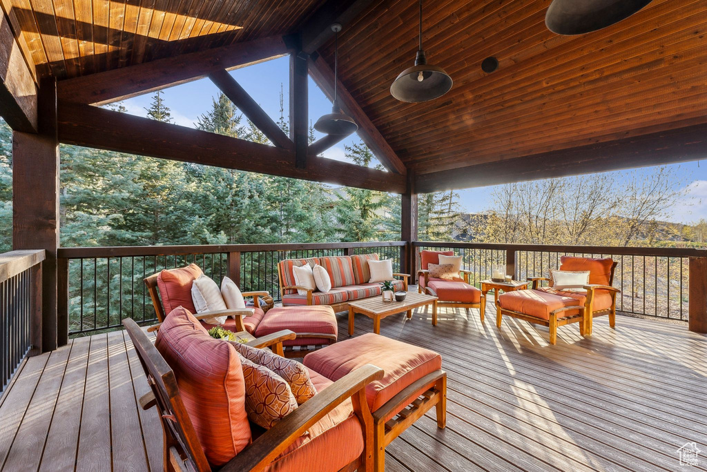 Wooden terrace featuring an outdoor living space
