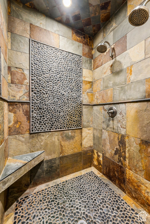 Room details featuring a tile shower
