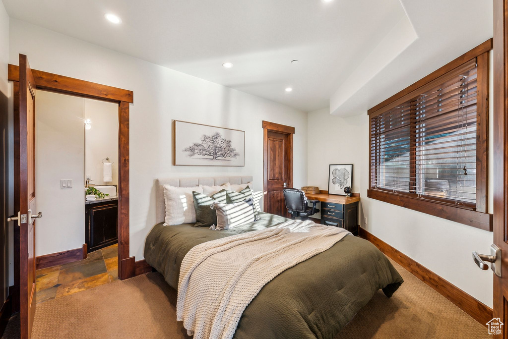 Carpeted bedroom with baseboards and recessed lighting